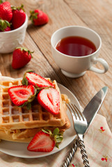Waffles with strawberries for breakfast