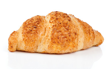 Fresh and tasty croissant with nut cream over white background