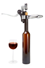 bottle with an opener  and a wine glass..