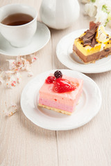 Cream pastries with chocolate and strawberries