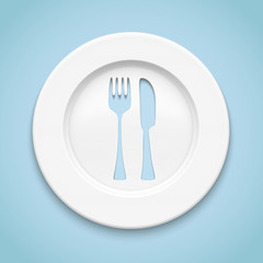 White plate with fork and knife cut.