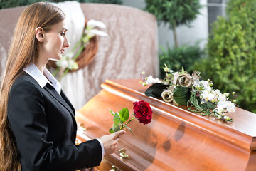 Mourning Woman at Funeral with coffin