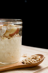 Glass of yogurt with muesli and fruit