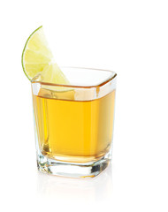 Shot of gold tequila with lime slice