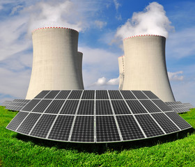 Solar energy panels before a nuclear power plant