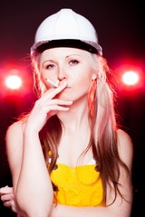 Naklejka premium Young architect woman construction worker smoking cigarette