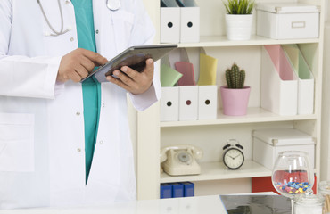 Doctor working on a digital tablet