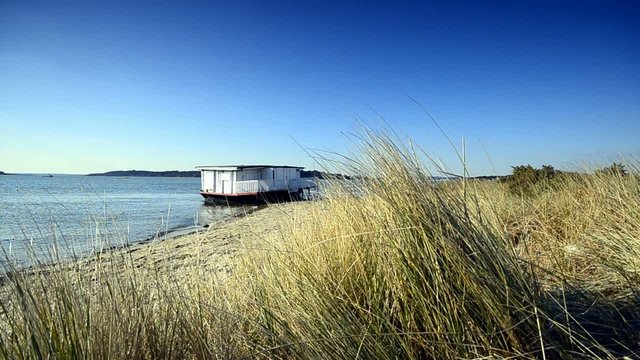 Old house boat on the beach at Studland in Dorset