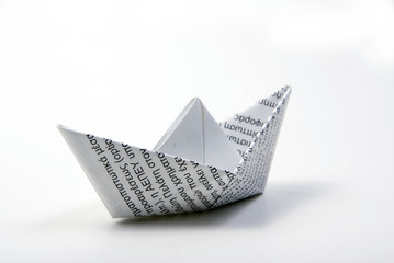printed paper boat on light background