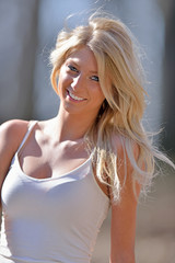 Fototapeta premium Stunning young blonde model smiling outside