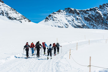 Fototapeta na wymiar Group of Ski player walking on the snow into the mountain