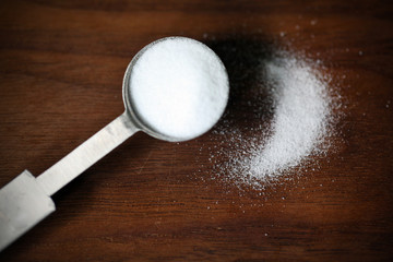 Baking soda or sodium bicarbonate in a tea spoon and dusted - 52274363