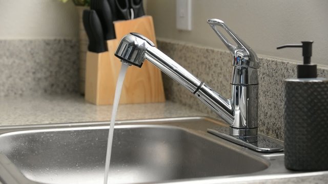 Kitchen sink faucet running water