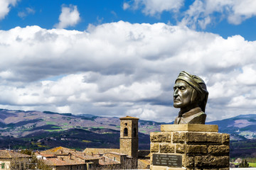 Statue of Dante Alighieri and ancient village