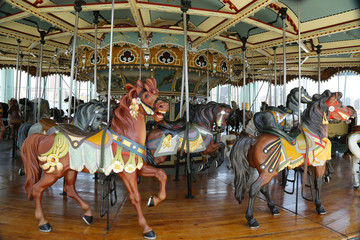 Fototapeta na wymiar Horses on a traditional fairground carousel