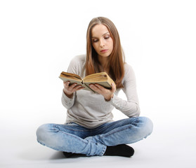 Fototapeta premium Young woman with book on white background