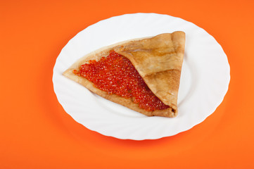 Pancake with red caviar