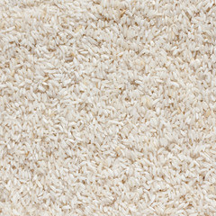 White long rice background, uncooked raw cereals