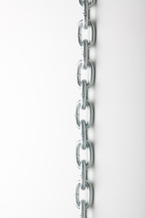 metal links of chain on a white background