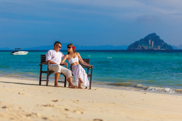 couple on the shore of a tropical island