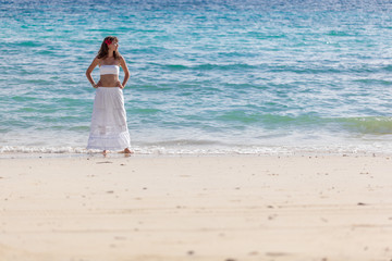 girl in a white dress on the beach