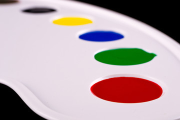 art palette with blobs of paint