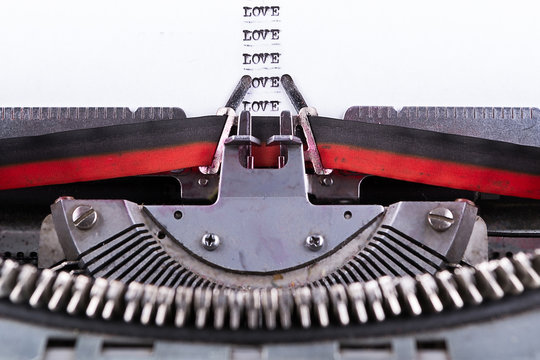 Concept about Love written on an old typewriter .