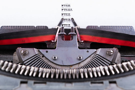 Concept about Kill written on an old typewriter .