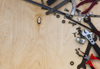 Set of different tools on wooden background