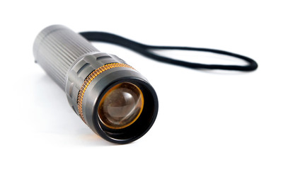 Black torchlight with strap on white background