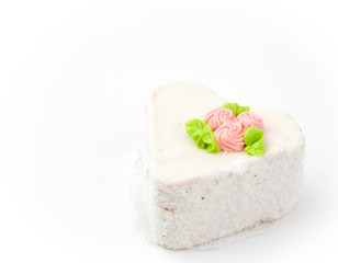 Cake in the shape of heart on a white backgrounds