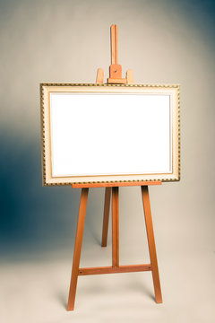easel with antique painting frame