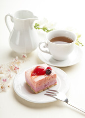 beautiful pink berries pastry, little cake with tea