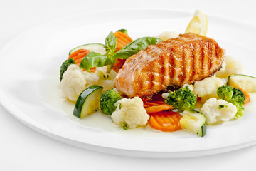 A Tasty food .Grilled salmon and vegetables. High quality image