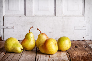 Group of pears on wood