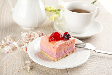 beautiful pink berries pastry, little cake with tea