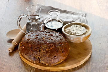 bread on wooden board with oil and wather