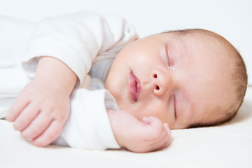 detail of adorable sleeping month old baby