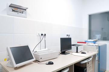 clean room with table and boxes for equipment .