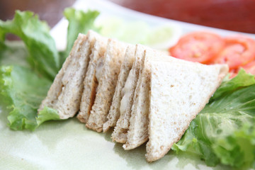 tuna sandwich on wood background