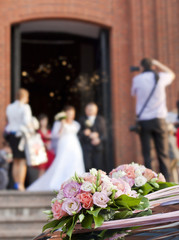 Bride and groom at church background concept