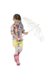 The little girl with an umbrella and in rubber boots. Isolated