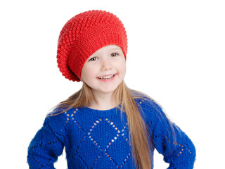 little girl in a red cap smiles, isolation on white