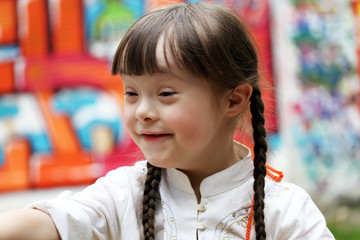 Portrait of happy little girl on the playground.