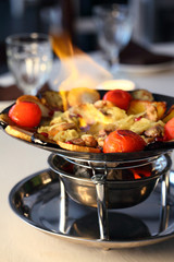A delicious lunch of potatoes, meat, tomatoes