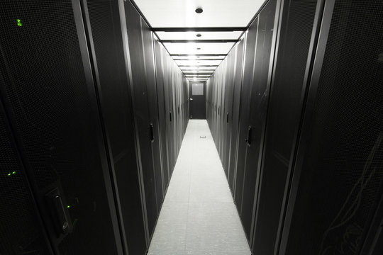 Telecommunication racks are symmetrically in sealed corridor
