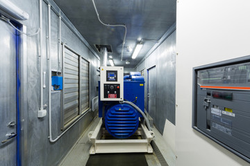 Diesel generator for backup power in room with control panel