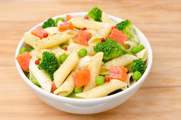 salad with pasta, smoked salmon, broccoli and green peas