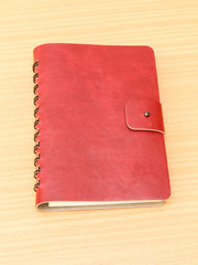 Leather cover of red notebook