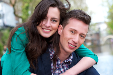 Fototapeta premium Portrait of a happy young couple outdoors